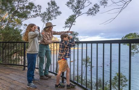 Two children and a ranger on a Junior Ranger tour in Merimbula. Credit: David Rogers &copy; DCCEEW