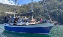 A group of people relaxing on a private boat tour with Refuge Bay Charters in Ku-ring-gai Chase National Park. Photo: Nicholas Baillie Jackson &copy; Refuge Bay Charters