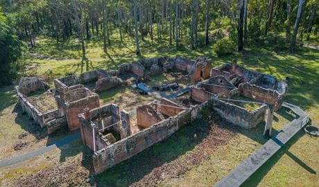 Aerial view of Innes Ruins, surrounded by lawn and trees, Innes Ruins Historic Site. Image: John Spencer/DCCEEW