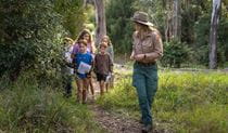 An NPWS ranger leads children on a Junior Ranger activity. Credit: David Rogers/DCCEEW