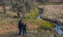 Hikers enjoying country views over a winding creek along Platypus Rock walking track in Werrikimbe National Park. Credit: Josh Smith &copy; Josh Smith/DCCEEW