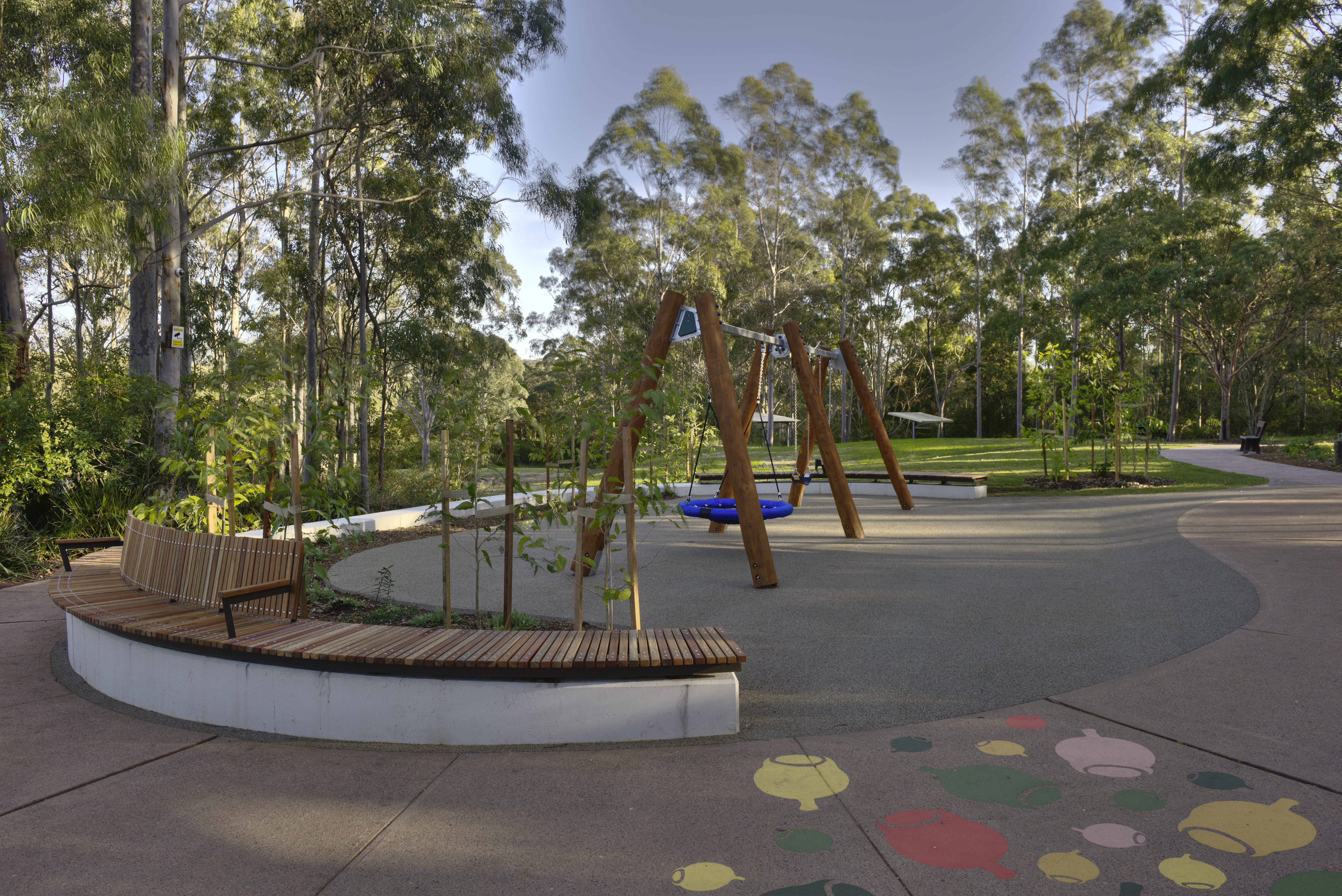 View of the playground, Village Green picnic area and playground, Blue Gum Hills Regional Park. Credit: Stuart Cohen, Bottle Brush Media © DCCEEW