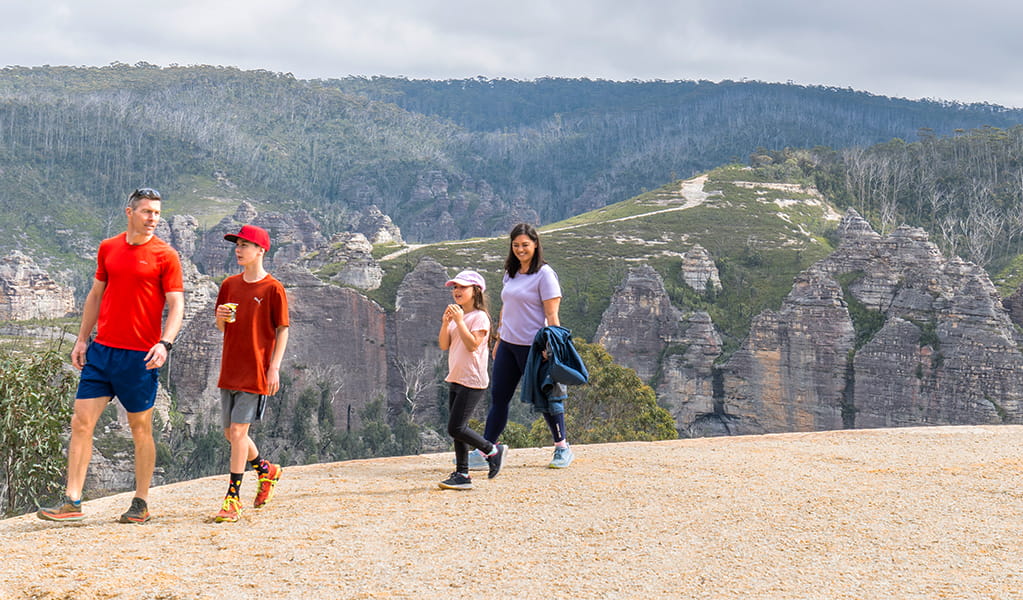 A family enjoying pagoda views at Lost City lookout in Gardens of Stone State Conservation Area near Lithgow. Credit: Simone Cottrell &copy; DCCEEW