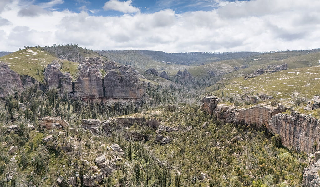 An aerial image of the unique rocky landscape at Gardens of Stone State Conservation Area surrounded by bush. Credit: Simone Cottrell &copy; DCCEEW