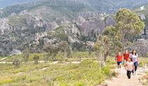 A family walking up to Lost City lookout on Lost City walking track in Gardens of Stone State Conservation Area. Credit: Simone Cottrell &copy; DCCEEW