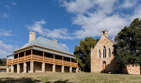 2 sandstone buildings, St Bernard’s Presbytery and Former St Bernard's Church, on a hill at Hartley Historic Site. Credit: John Spencer &copy; DCCEEW