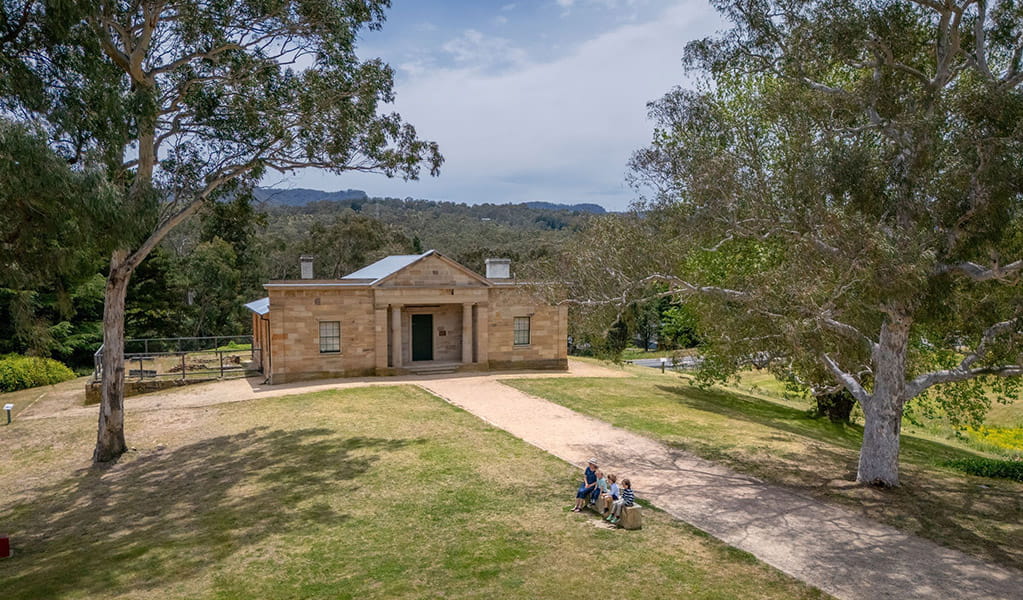 An aerial image of people sitting outside Hartley Courthouse at Hartley Historic Site. Credit: John Spencer &copy; DCCEEW