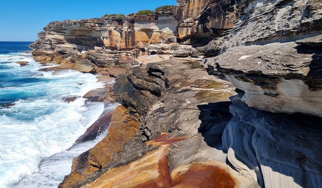 Skylight cave is located on a dangerously narrow, slippery rock edge with pounding waves below, Kurnell area, Kamay Botany Bay National Park. Photo: Jeremy Malgras &copy; DCCEEW