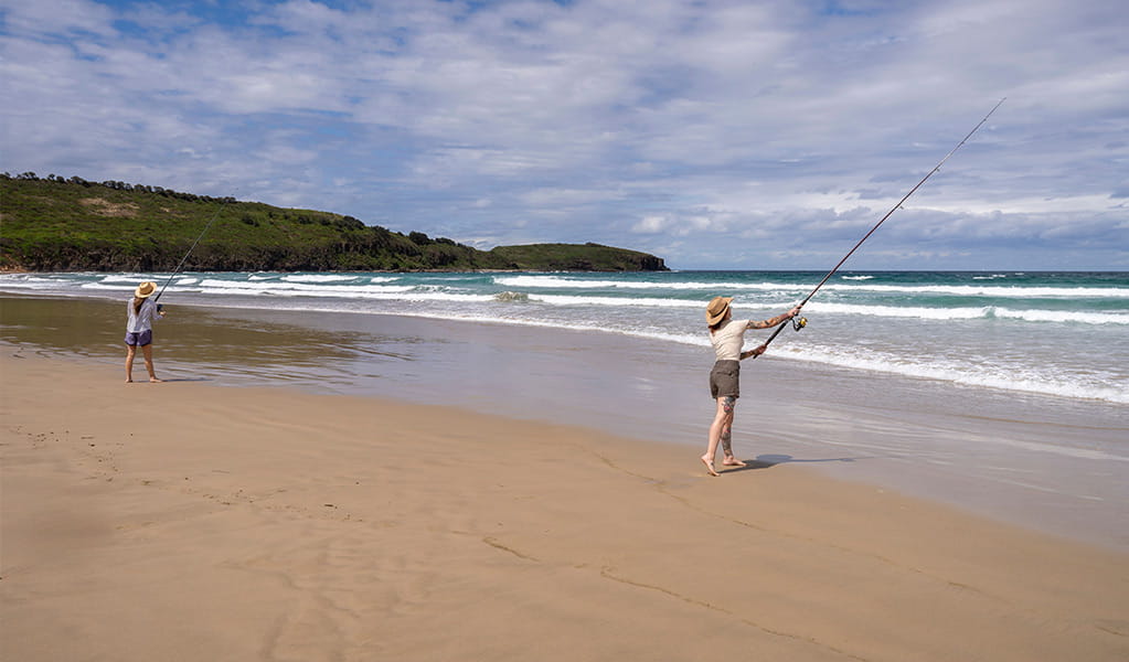 2 people fishing from the sand at Killalea Beach - The Farm. Photo: John Spencer/DCCEEW &copy; DCCEEW