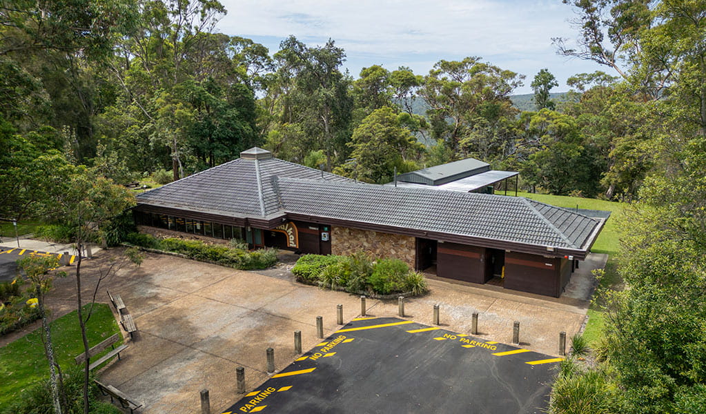 Aerial view above Kalkari Discovery Centre in Ku-ring-gai Chase National Park. Photo: Johny Spencer &copy; DCCEEW