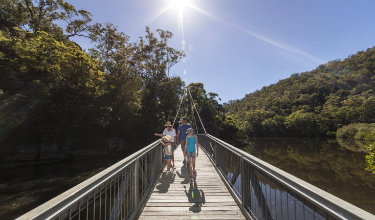 Family walking along Gibberagong walking track at Bobbin Head in Kur-ring-gai Chase National Park. Photo: David Finnegan &copy; OEH