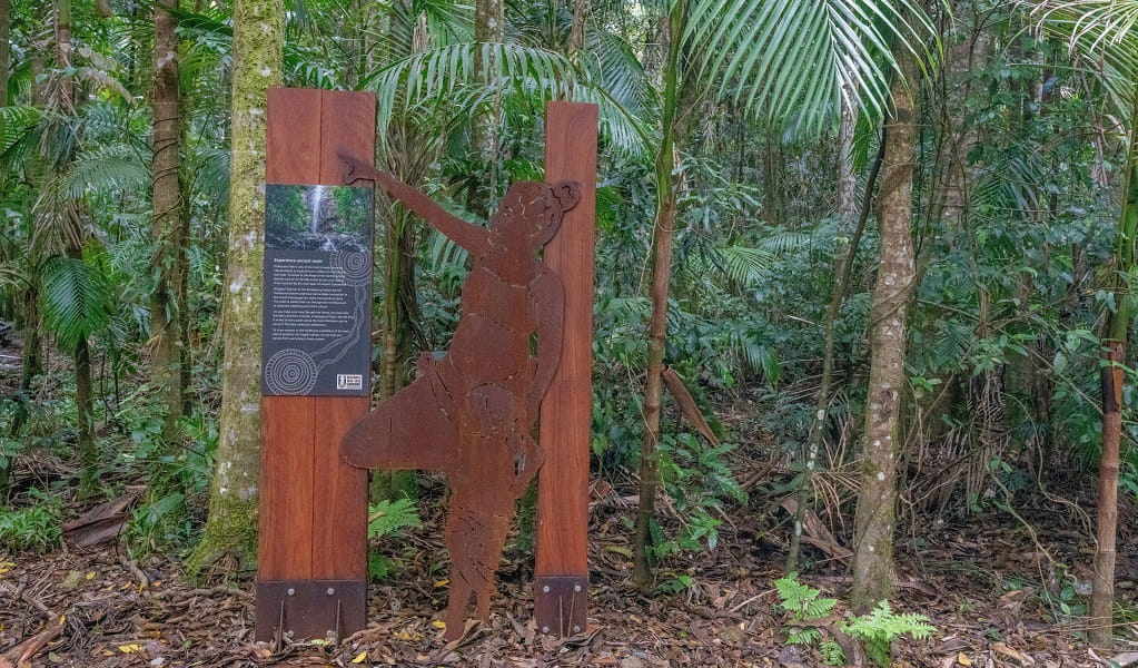 A metal sculpture of an Aboriginal mother and child at Terania Creek picnic area, Nightcap National Park. Photo: John Spencer/DCCEEW 