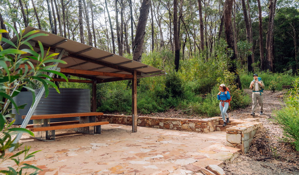 Campers arriving at the sheltered picnic table at Yelgun Kyoomgun campground. Photo: Remy Brand &copy; Caravel Content.