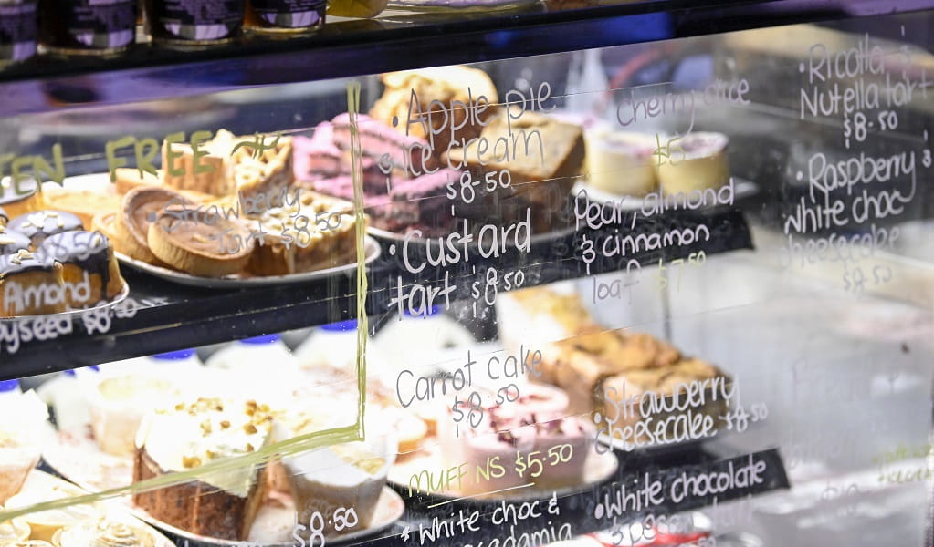 A glass counter with cakes on display at the Rainforest Cafe, Sea Acres National Park. Credit: Adam Hollingworth/DCCEEW &copy; DCCEEW