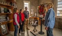 A guided tour group at Cape Byron Lighthouse, Walgun Cape Byron State Conservation Area. Photo: John Spencer &copy; DPIE