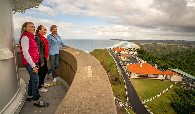 A tour group enjoy views from the top of Cape Byron Lighthouse, Walgun Cape Byron State Conservation Area. Photo: John Spencer/OEH.