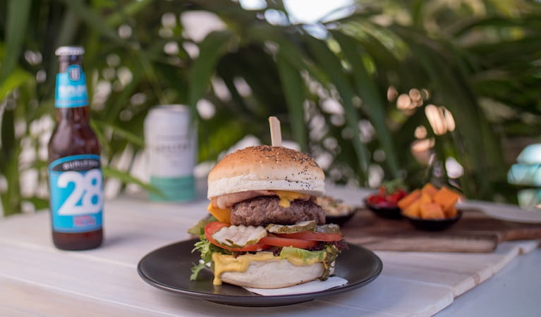 Burger on the menu at The Pass Cafe, Walgun Cape Byron State Conservation Area. Photo: Kyle James Healy