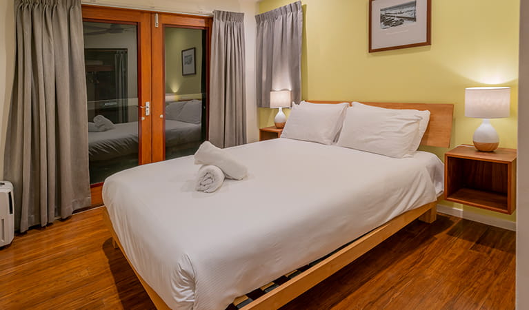 Clean, large bedroom with a queen bed with  Mildenhall cottage. Photo: DPIE/John Spencer