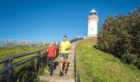 2 people jogging on Walgun Cape Byron walking track. Photo: John Spencer &copy; OEH